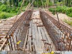 LANJUTAN PEMBANGUNAN JEMBATAN SUNGAI ASANA KEMBALI TERANCAM AMBLAS ?